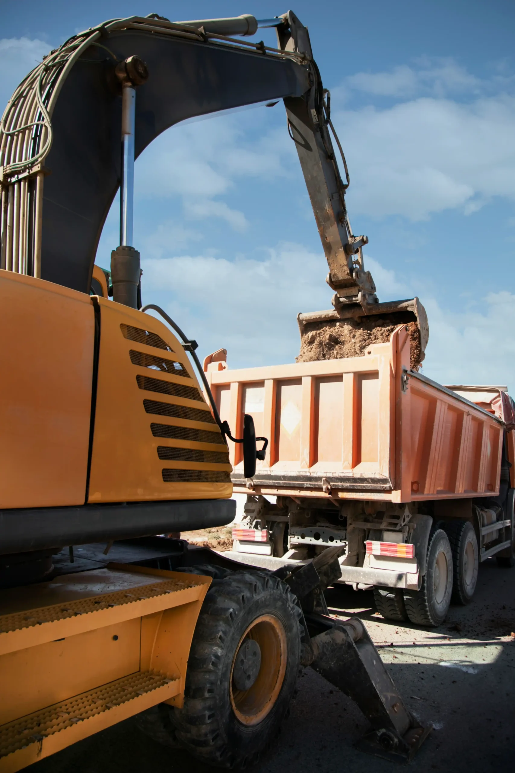Excavator digging ground day light 11zon scaled